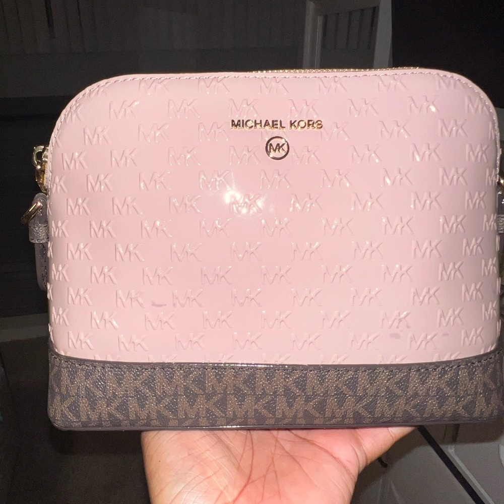Baby pink and brown crossbody bag.